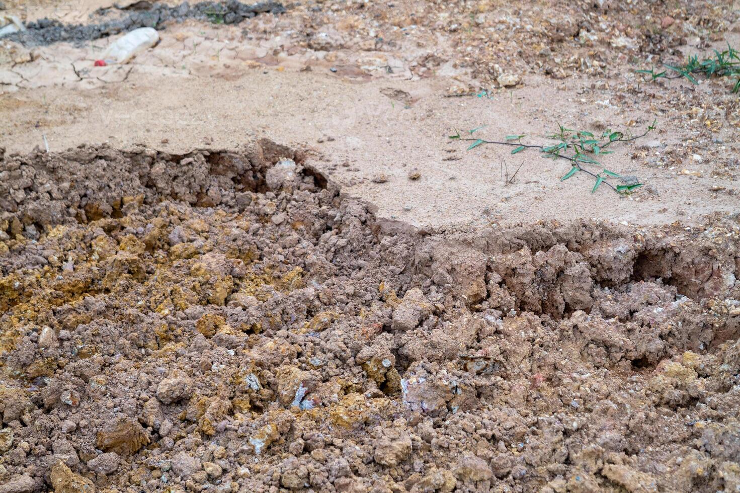 Ground erosion event at construction site soil displacement detailed view urban environment photo