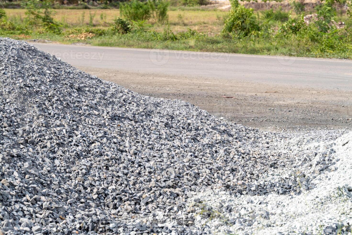 Construction site gravel pile rural road industrial scene open environment ground level material supply photo
