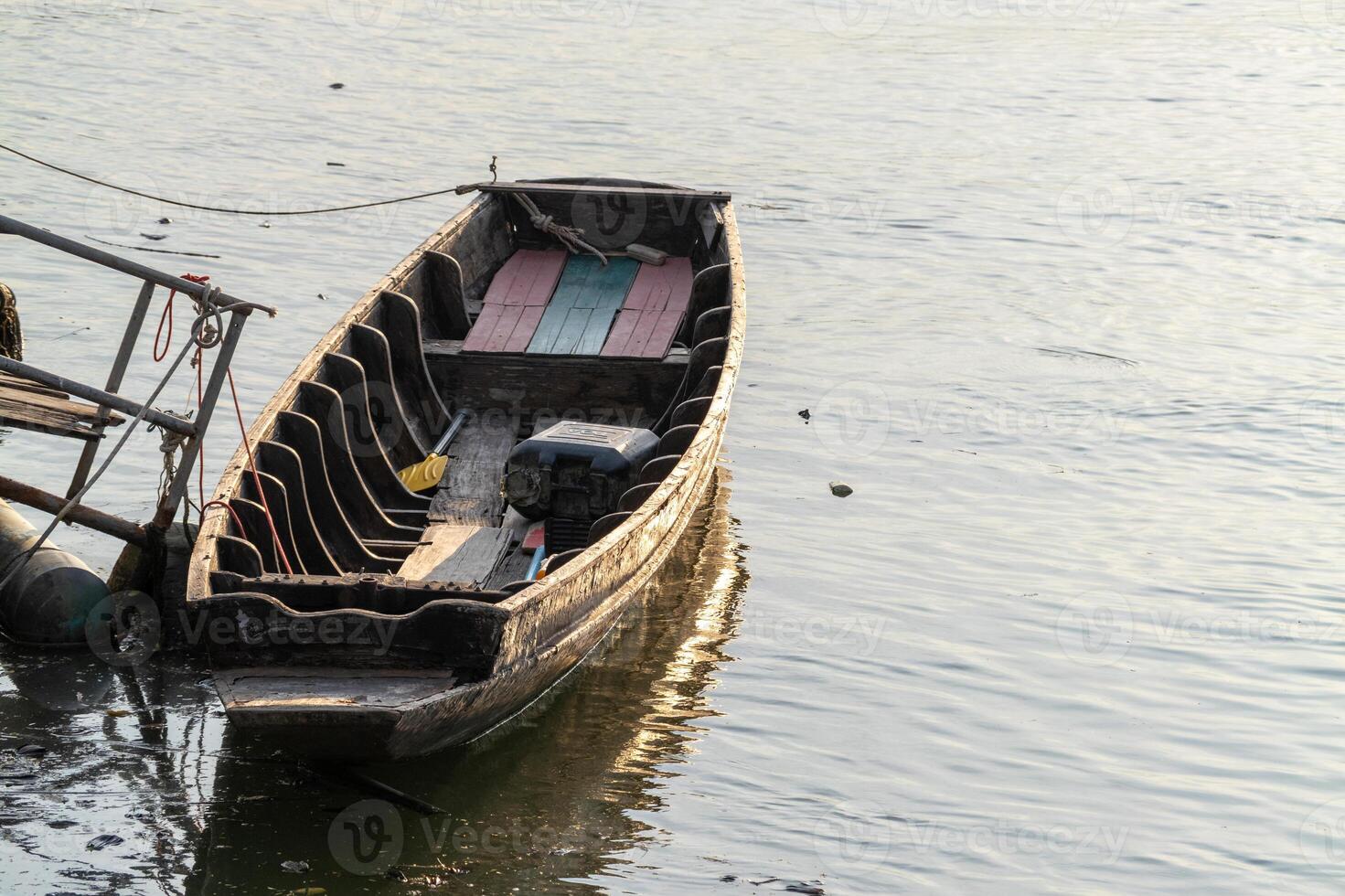 Serene boat at sunset riverside calm water close-up tranquility photo