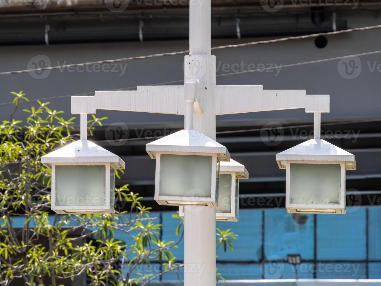 Illuminated street lamps urban park daylight close-up modern design photo