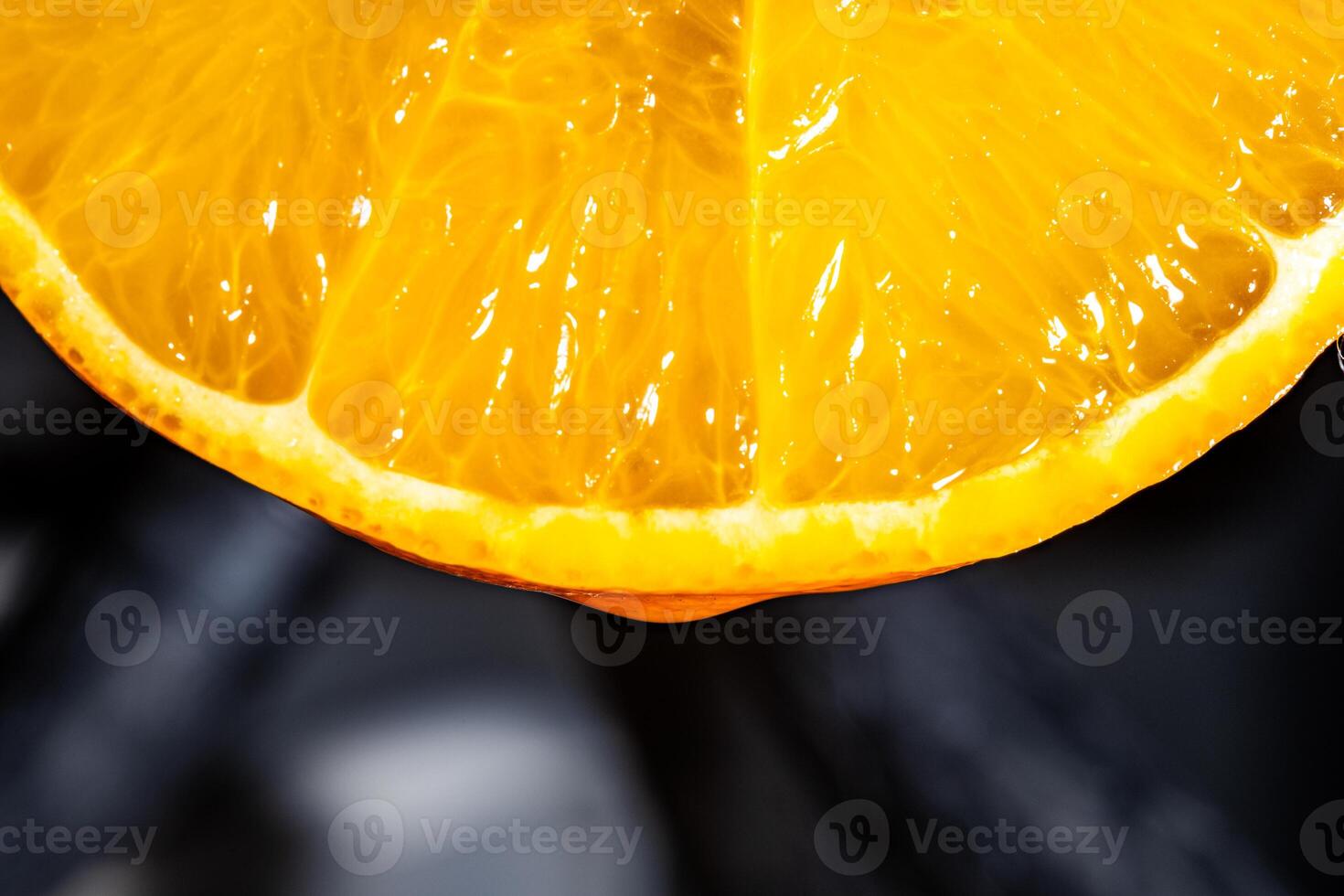 Close Up of Juicy Orange Slice with Vibrant Citrus Texture photo