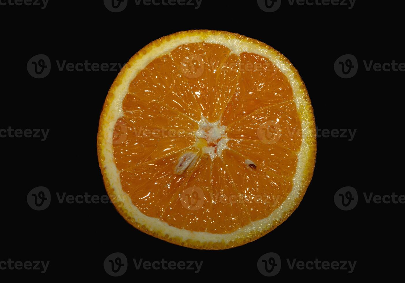 A close up of an orange with a small hole in the center photo