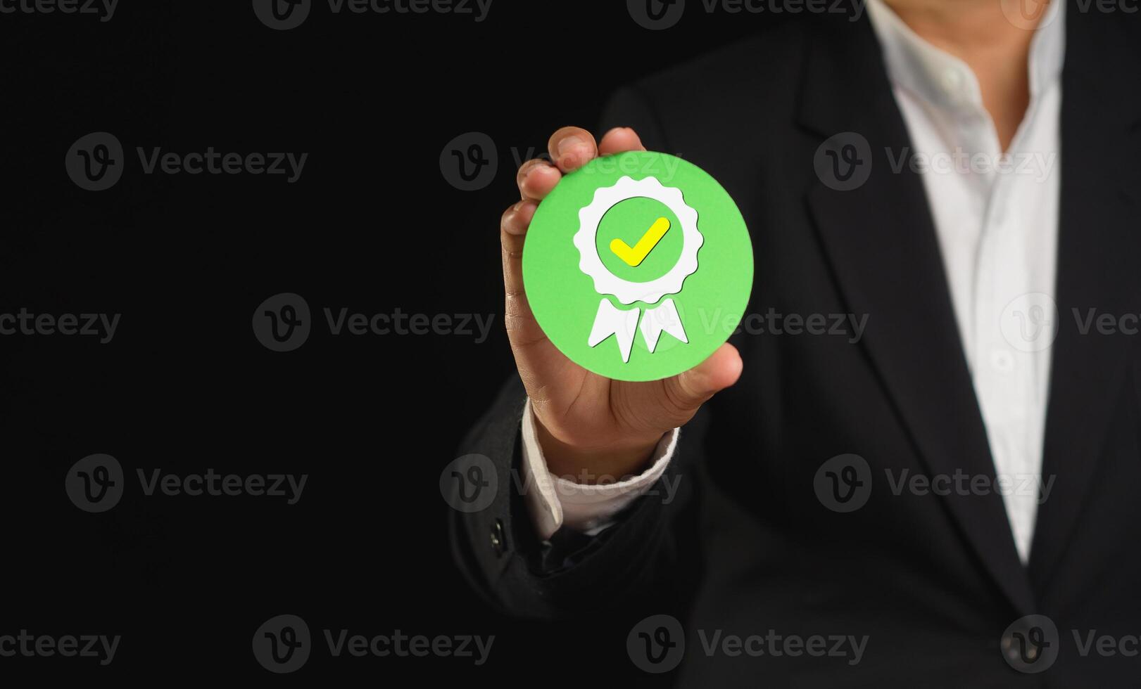 The best quality symbol assurance for a service, and ISO certification on a hand businessman. Space for text. photo