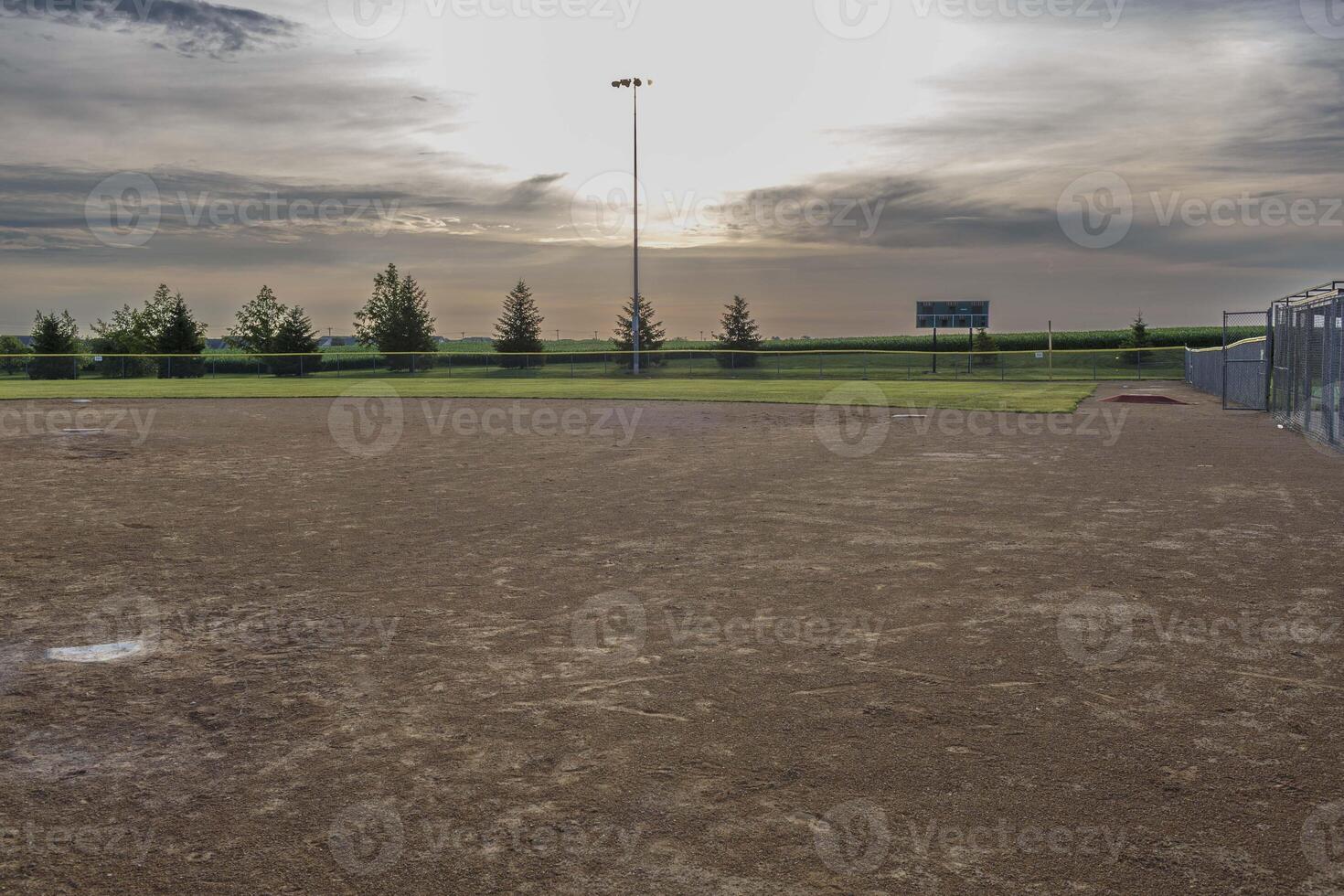 an umpires view from homeplate to first base on a baseball field photo