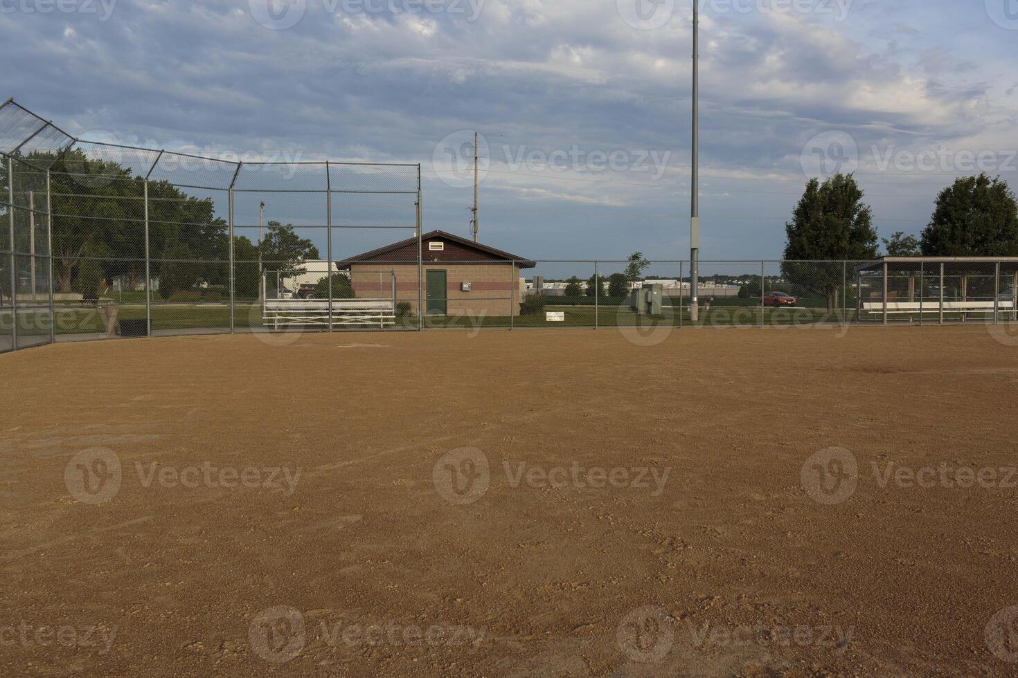 a view from first base to home plate and the third base dugout on a baseball field photo