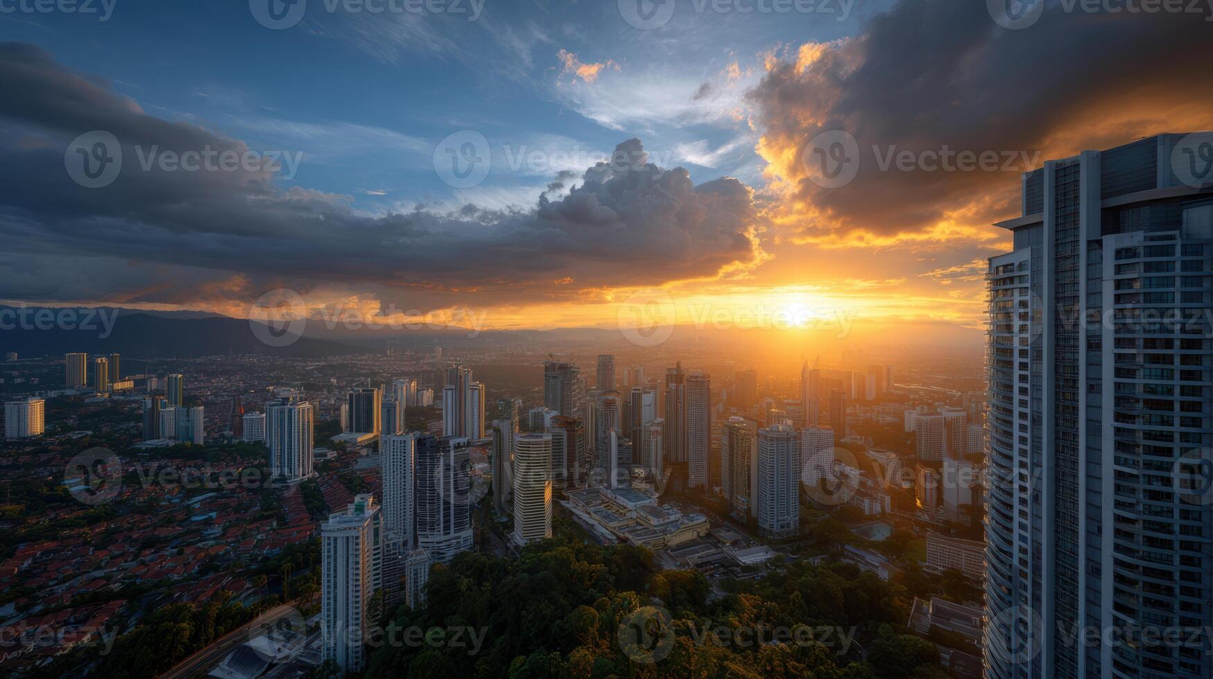 Golden sunrise over Kuala Lumpur modern architecture skyline with dramatic clouds casting shadows over the vibrant cityscape photo