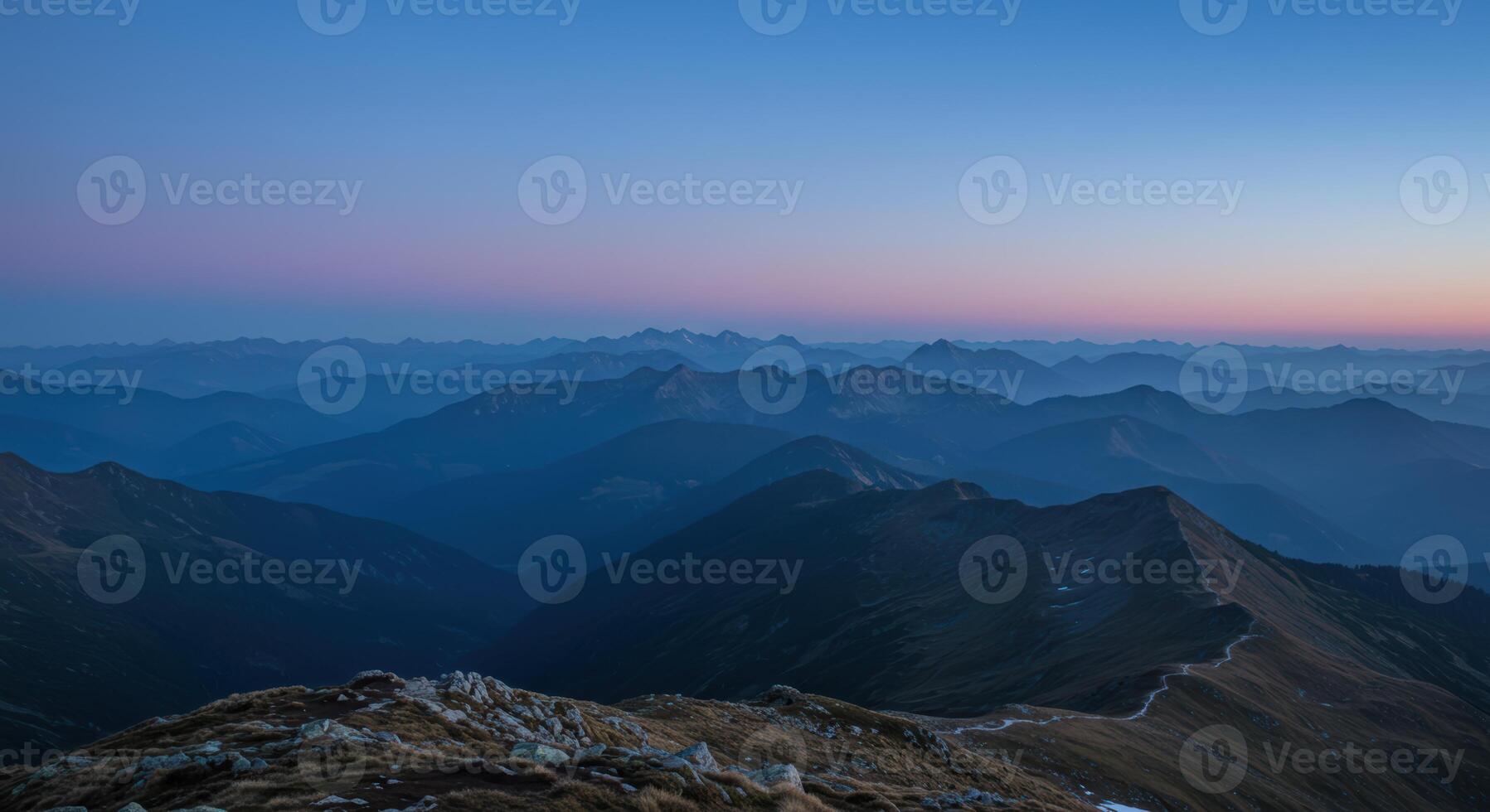 Scenic alpine mountain landscape with beautiful sunset colors over the majestic peaks in the Alps Europe photo
