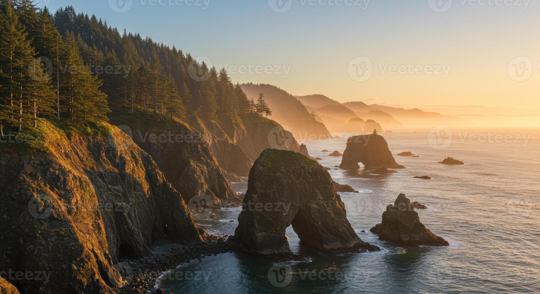 Golden sunset illuminates sea stacks and dramatic cliffs along the scenic Oregon coast offering a breathtaking natural vista photo