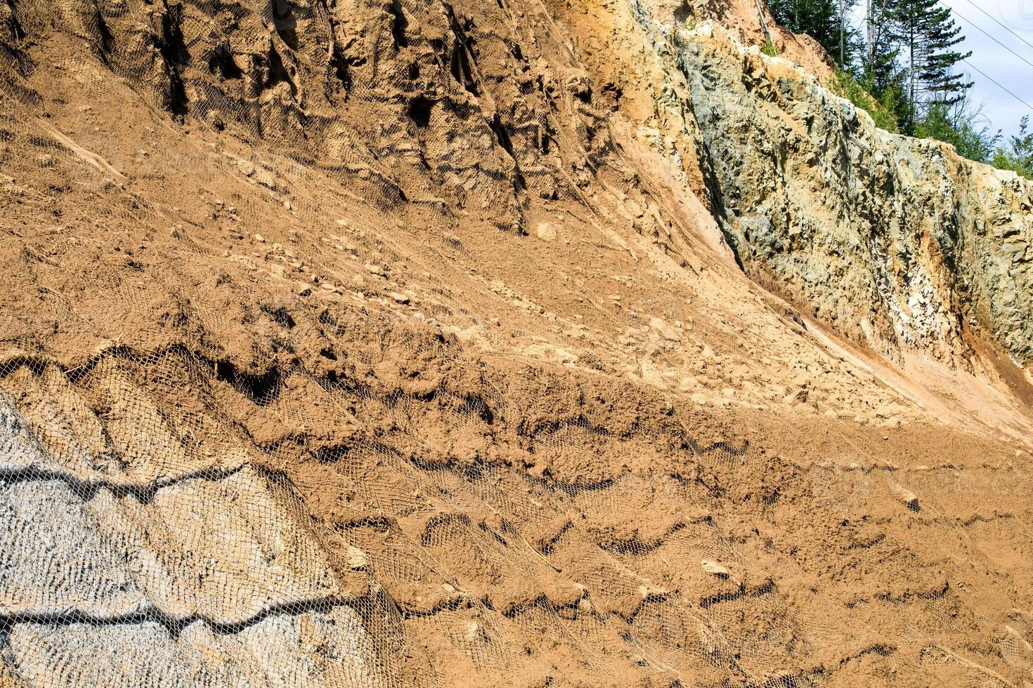 Rugged sediment layers cascade like ancient historys tapestry, revealing geologists dreams and Earth Days quiet meditative gaze photo