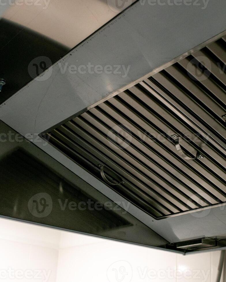 Sleek industrial kitchen vent, echoing culinary symphonies, Feng Shui auspicious metal, International Chef Day inspiration glows photo