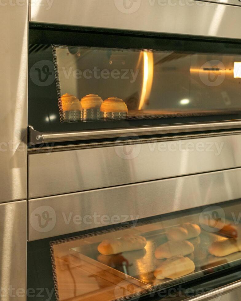 Golden pastries nestled in a double oven, evoking cozy Yule baking traditions and National Pastry Day delights photo