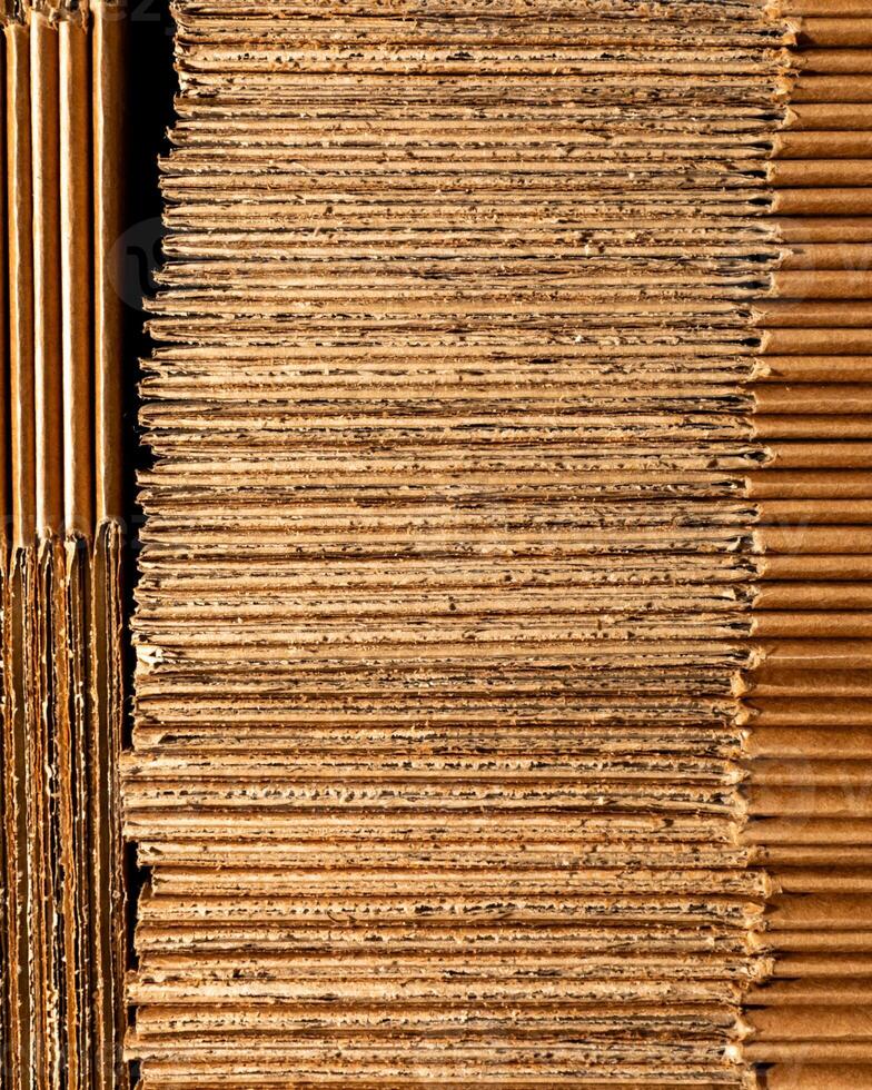 Rustic corrugated cardboard stacks, evoking Pachamamas earthy texture, prime for creative upcycling, or quirky Boxing Day projects photo