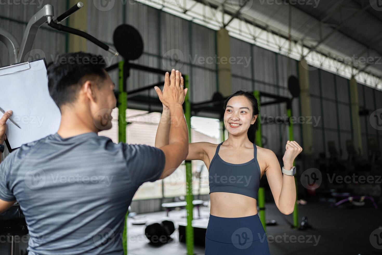 Personal Trainer and Client Engaging in Fitness Session photo