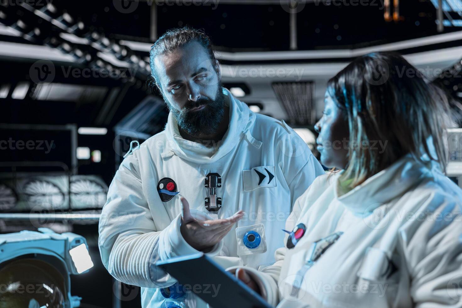 Astronauts doing brainstorming, conducting safety checks using tablet during long distance space travel. Starship colleagues talking, updating flight log during cosmic journey photo