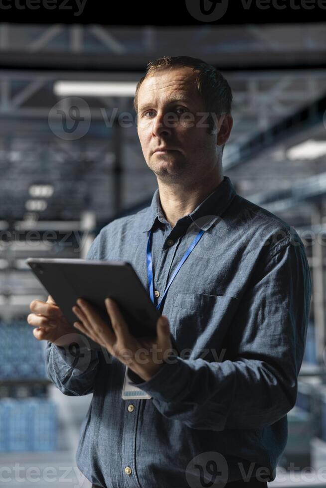 Admin on data center industrial platform analyzing infrastructure performance, minimizing downtime and equipment failure risks. Server farm employee doing job tasks, automating anomaly detection photo