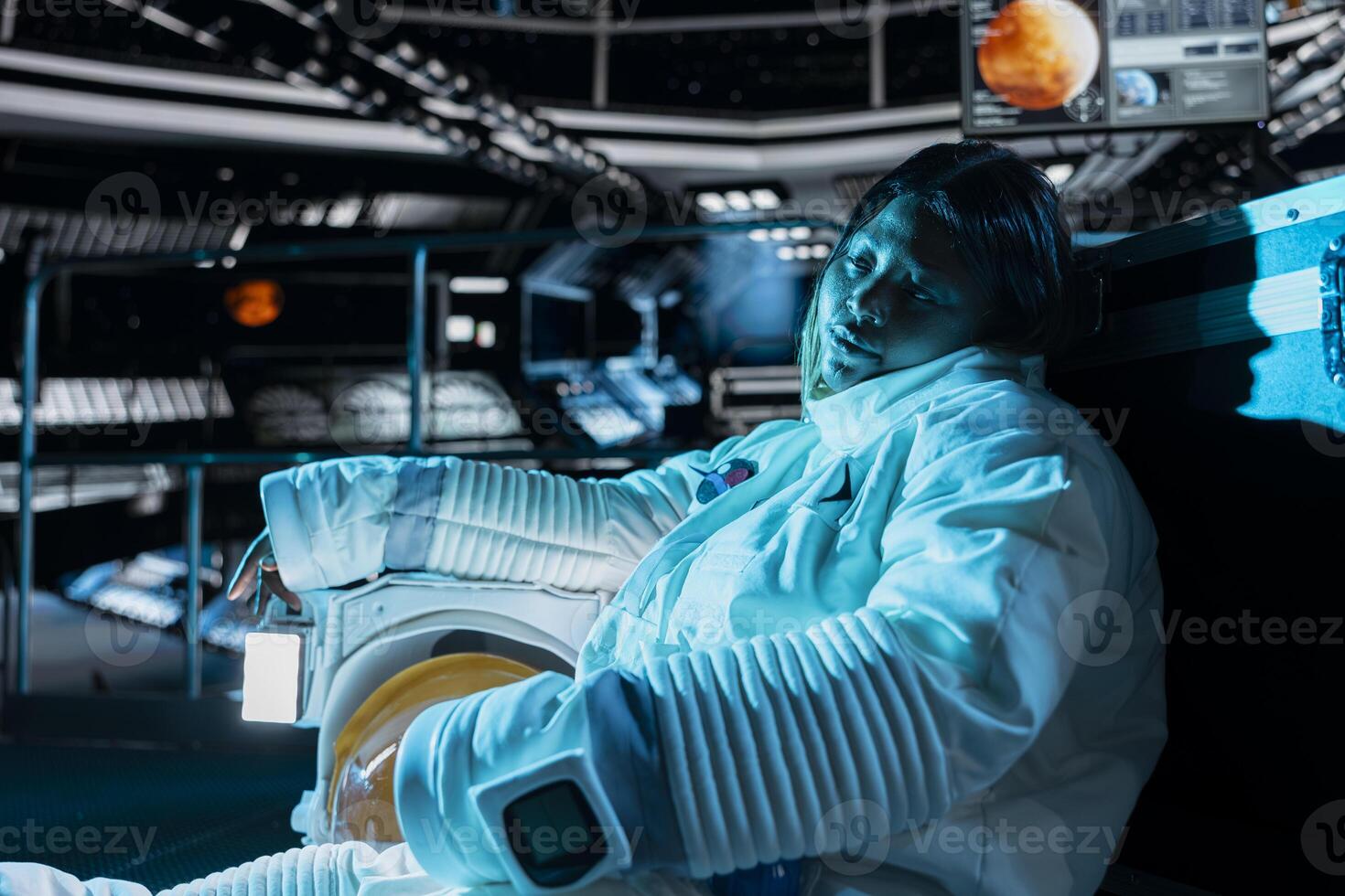 Cosmonaut collapsed after sudden illness during space station catastrophe. Blue lights flashing over crew member facing medical crisis triggered by extreme cold in damaged starship photo