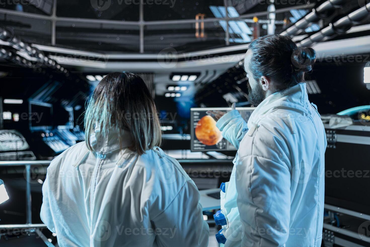Team of astronauts doing brainstorming before landing spaceship on Mars. Teamworking orbit station colleagues doing mission on red planet surface to test human survival in deep space photo