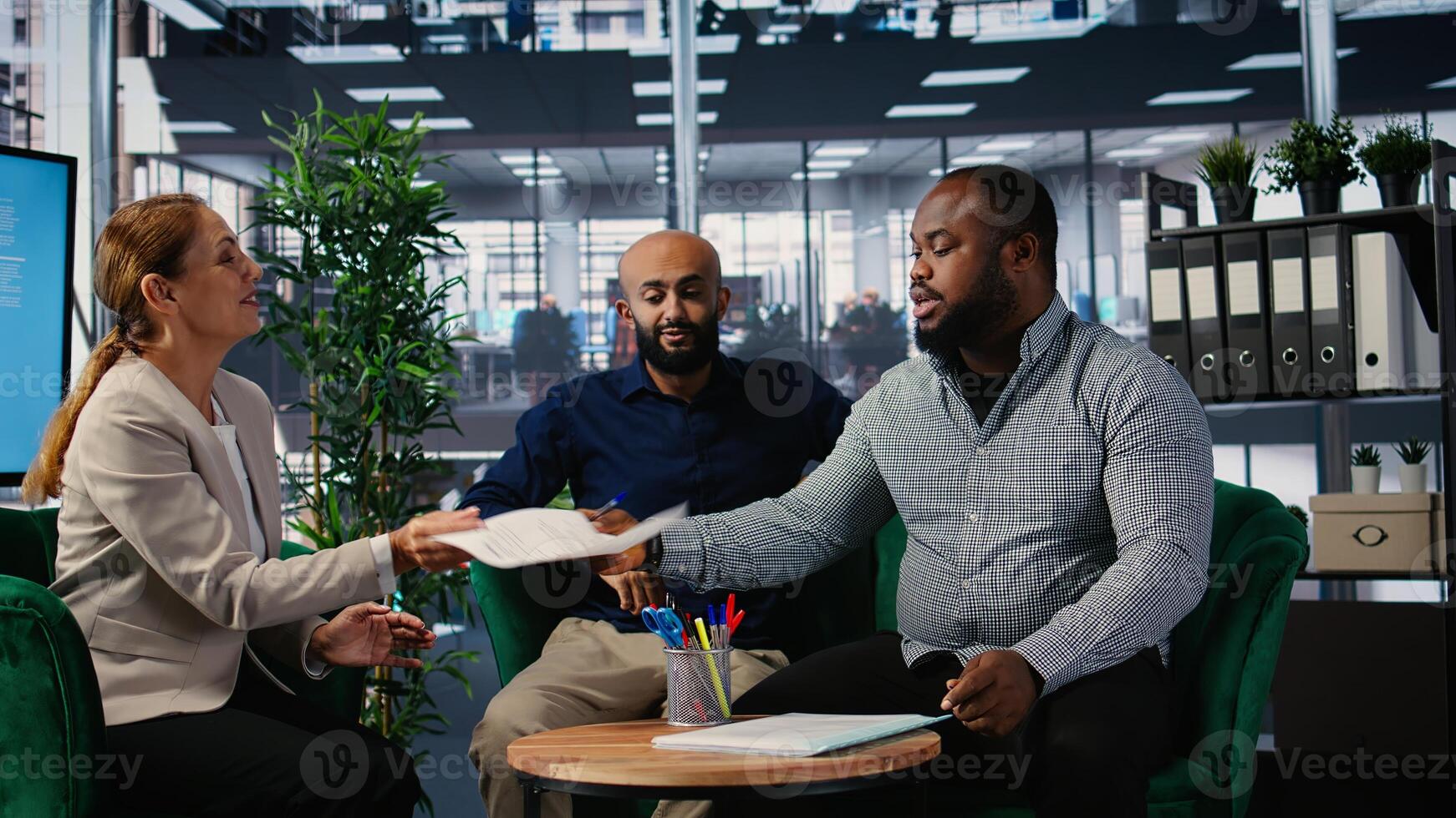 African american business leader signing a new partnership legal contract, agreeing to a collaboration between international companies. Entrepreneur gives signature for the conditions. Camera A. photo