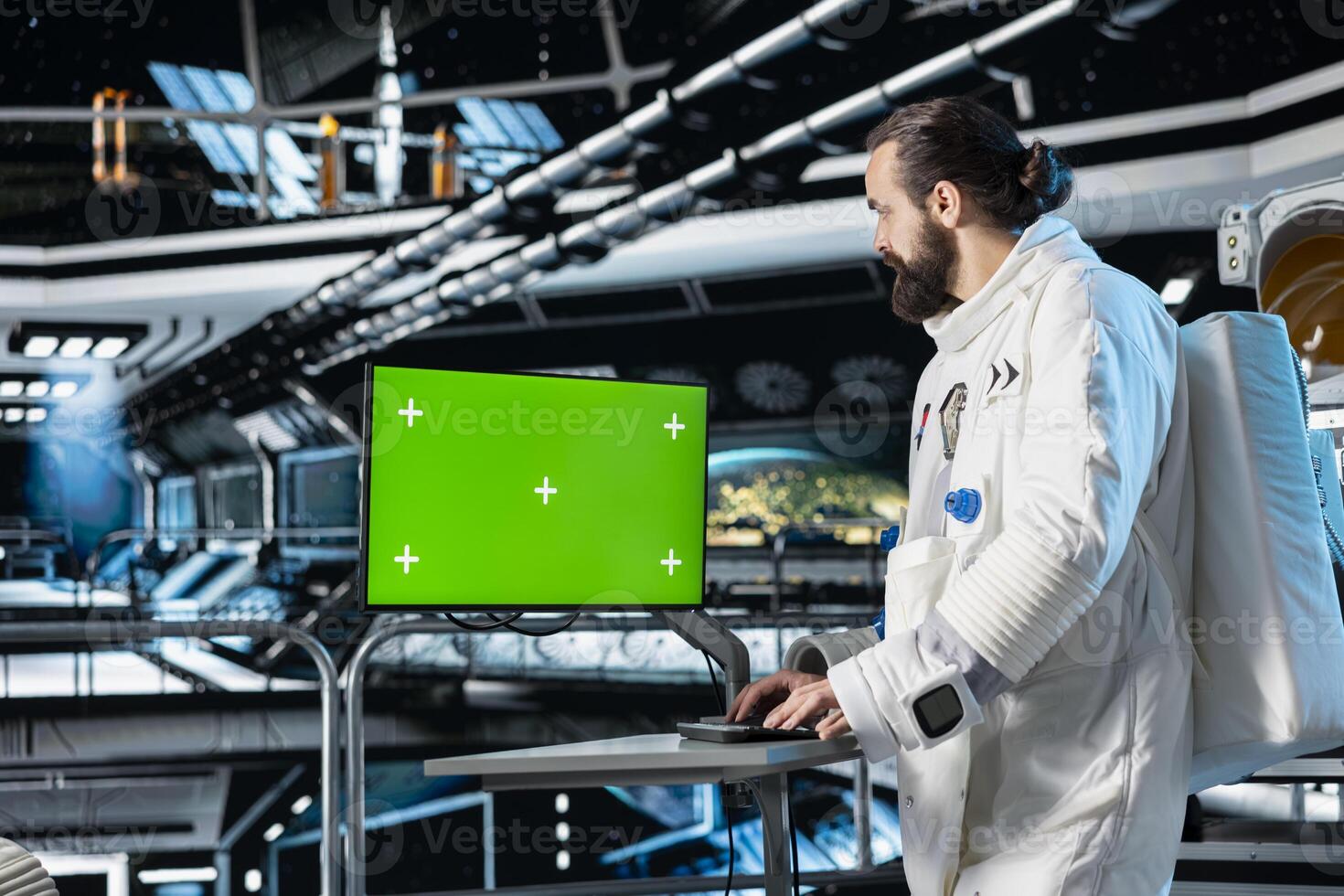 Astronaut in starship using green screen monitor to confirm suit integrity. Orbital station crew member testing gear during routine equipment check using chroma key mockup display photo