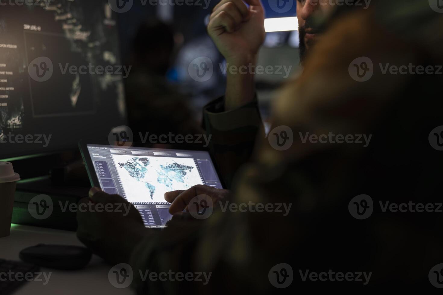 Army officers managing air traffic control using radar surveillance software on tablet. Close up of military agents following enemy units on reconnaissance satellite system using device photo