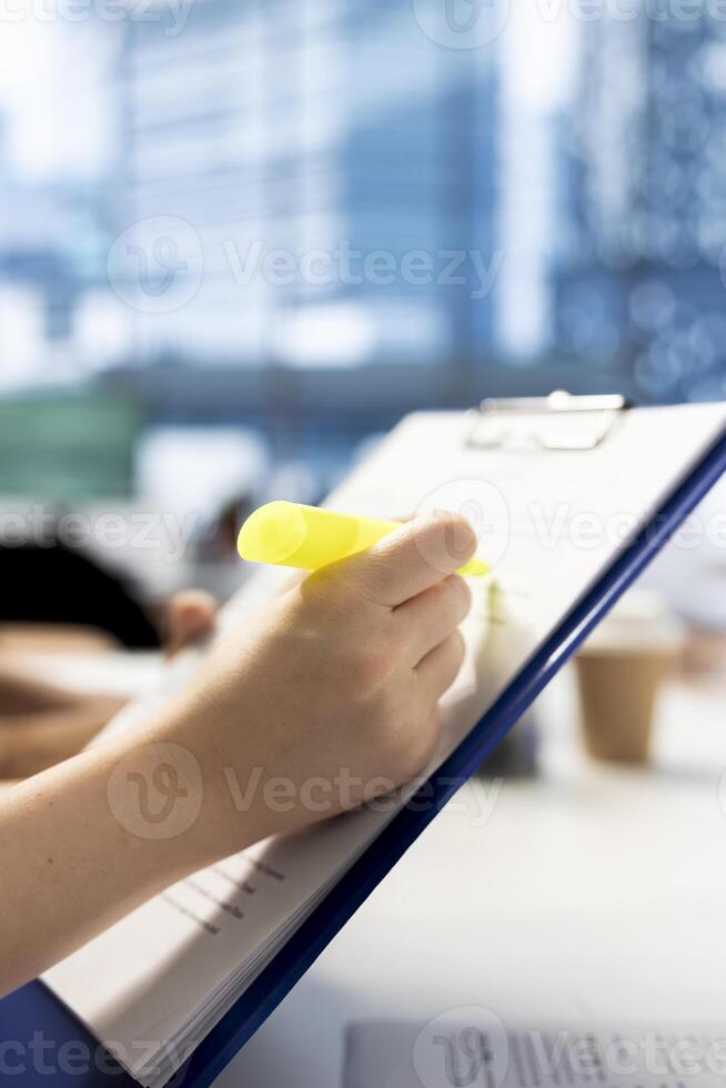 Recruiter using highlighter marker to present contract after finding best talent to fill open company position. Close up of HR employer hired to assess skills of candidate, highlighting text photo