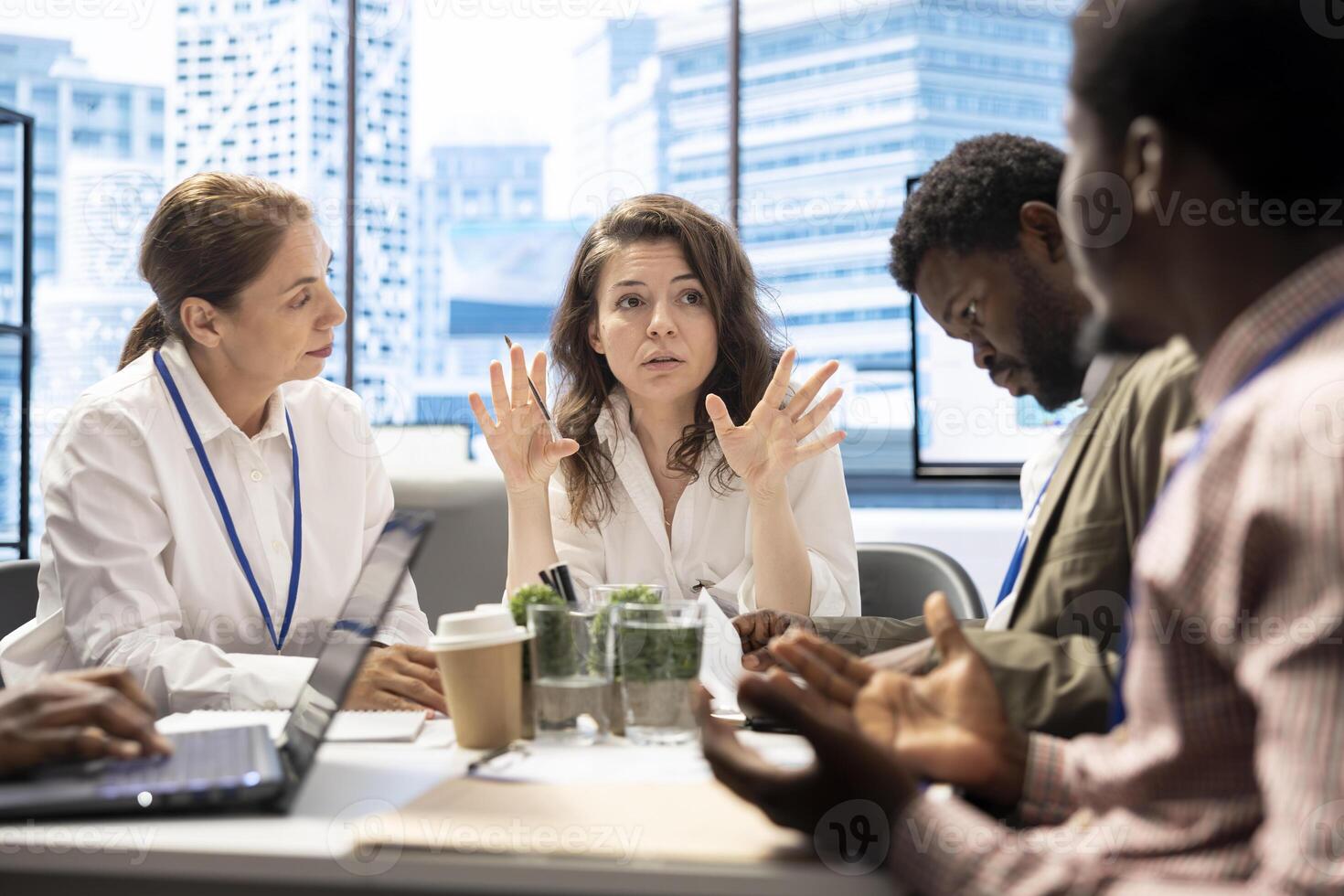 During a briefing meeting, general manager and his work team discussing budget forecasts and making financial projections to achieve enterprise goals. Analyzing market trends. photo