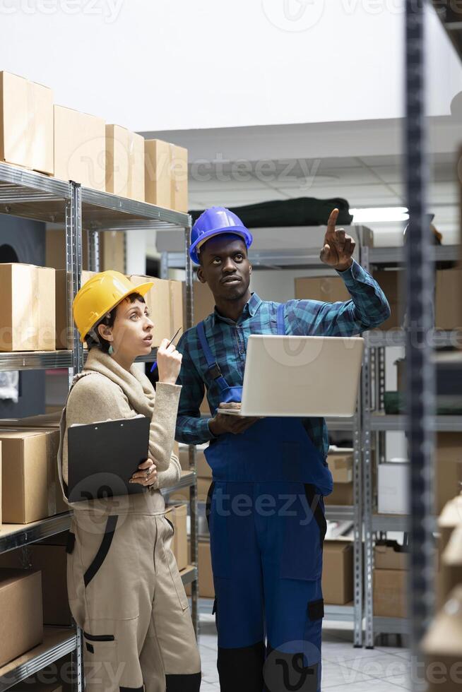 Factory operations rely on warehouse staff who manage pallets and cargo, overseeing order shipment and organizing shelving systems for effective inventory management and transportation. photo