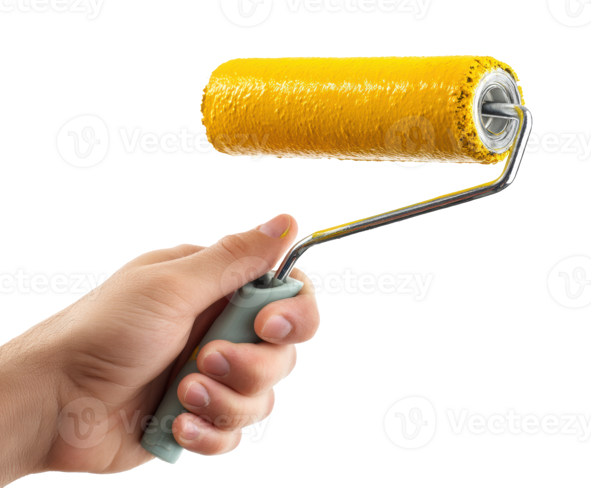 Hand holding paint roller with yellow paint for home renovation png