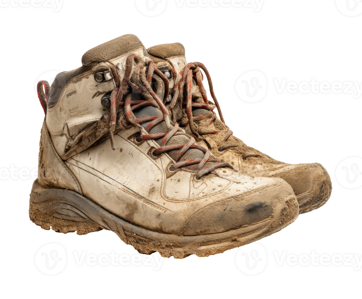 Worn hiking boots covered in mud after an outdoor adventure png