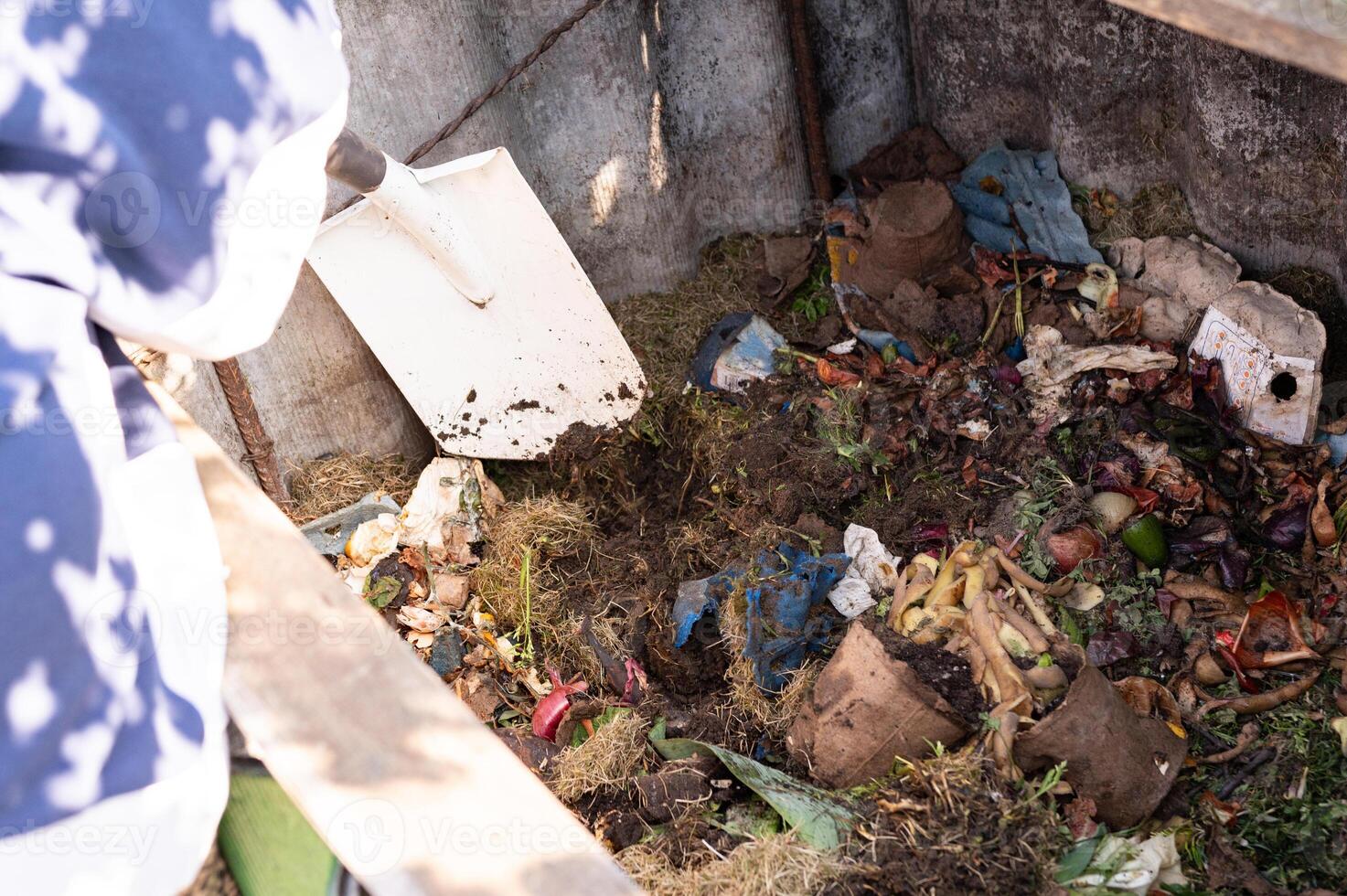 Learn About Composting Day Composting process organic waste decomposition with shovel in bin photo