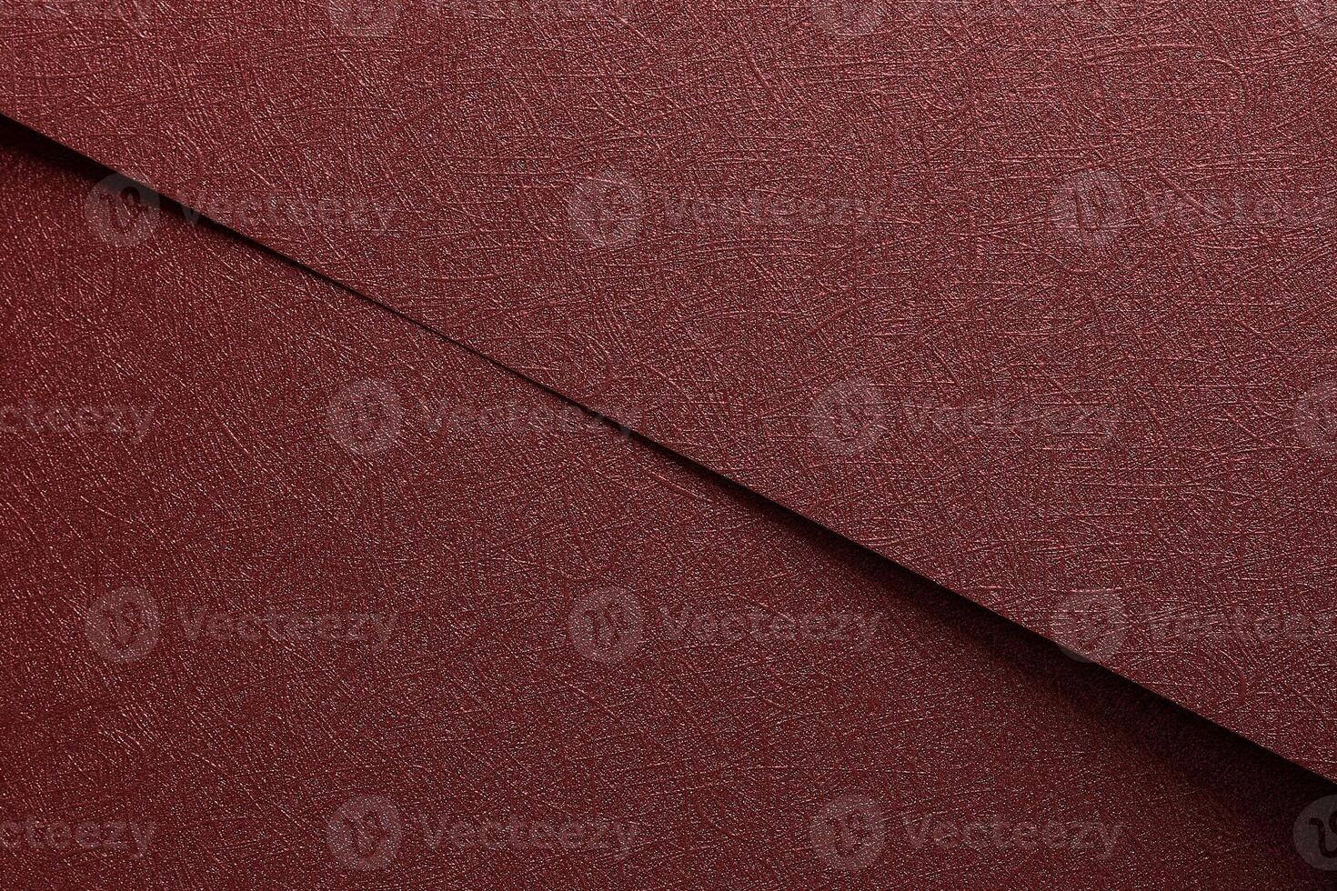 Chic paper background in red and marsala. Metallic sheets with glossy gradient, smooth surface, photo