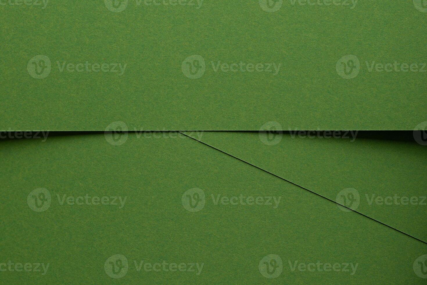 Chic green texture background. Monochrome matte surface with smooth fiber detail, geometric overlay photo