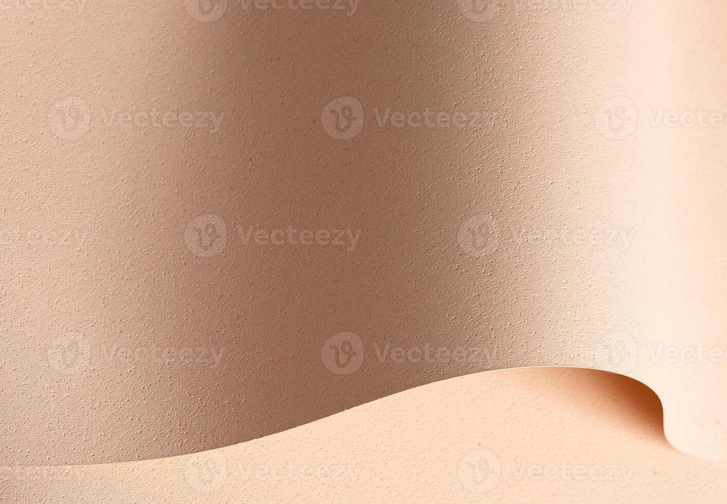 Elegant designer paper in beige and cream tones with rough grained texture and pierced surface. photo