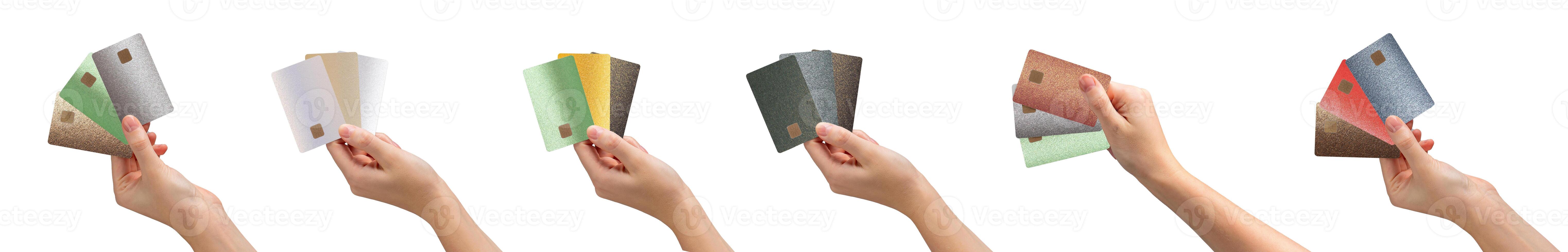 Bank card in hand, holding several cards fanned out, offering different options for payment and photo