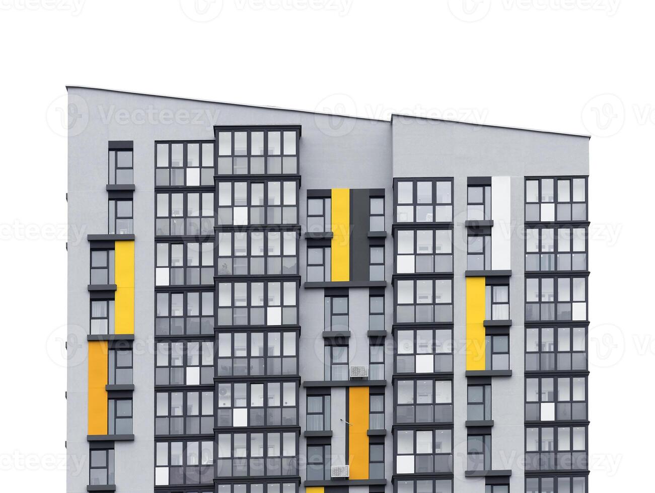 Tall apartment building with geometric facade and multiple windows. Modern condominium structure photo