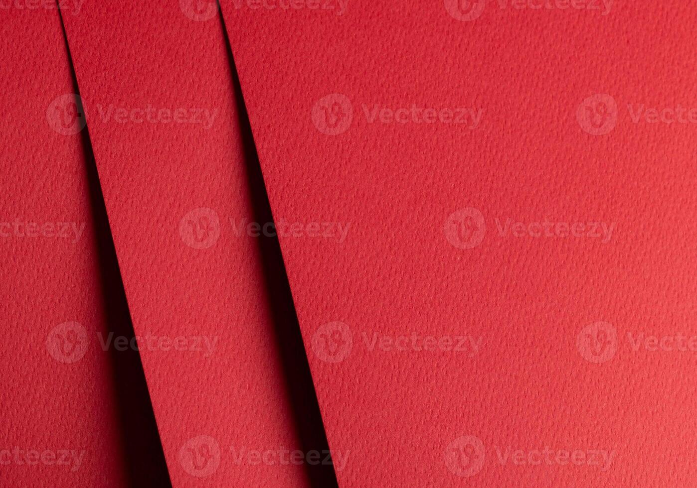 Premium red designer paper sheet with smooth matte texture. Bright, festive background with photo