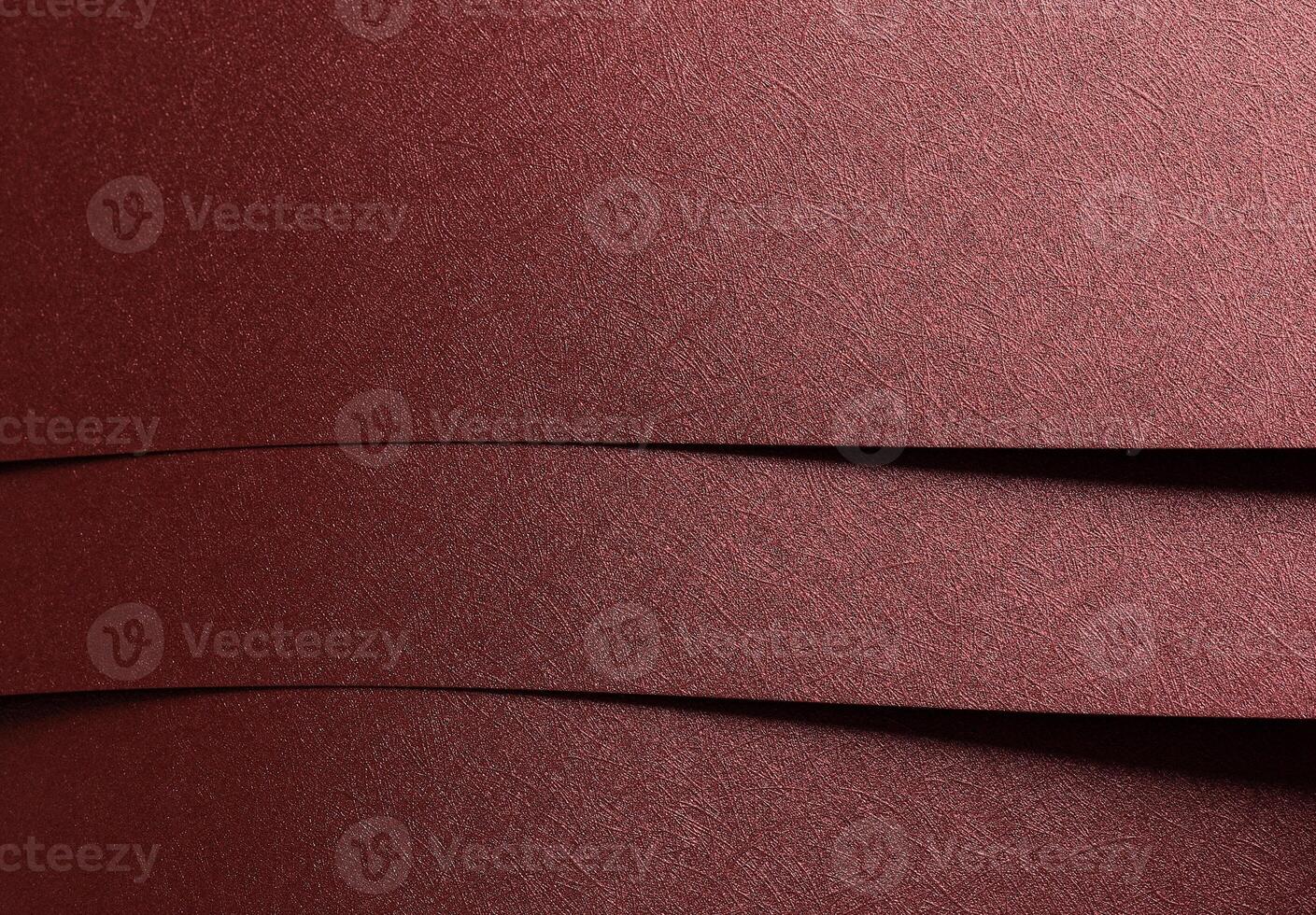Paper background closeup. Red and marsala metallic sheets with geometric overlap, shiny gloss, photo