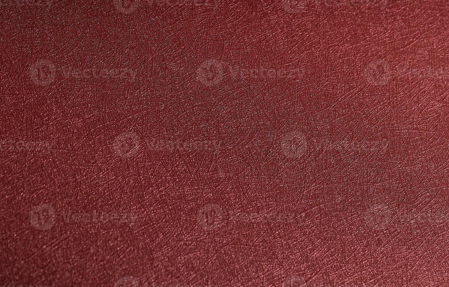 Minimalistic designer paper closeup. Monochrome red and marsala background with glossy metallic photo
