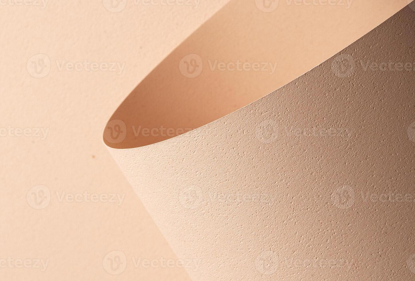 Chic designer paper closeup. Monochrome background in beige and cream color with matte grained photo