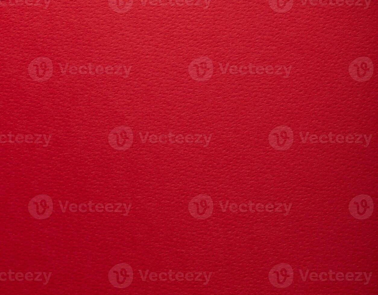 Elegant red designer paper with smooth matte texture. Bright, festive background, minimalistic and photo