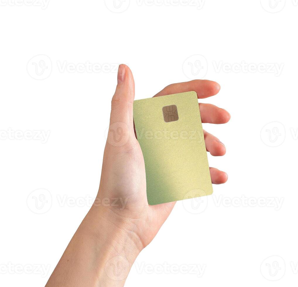 woman holding a bank card in hand, showcasing a credit or debit card with a chip. The card photo