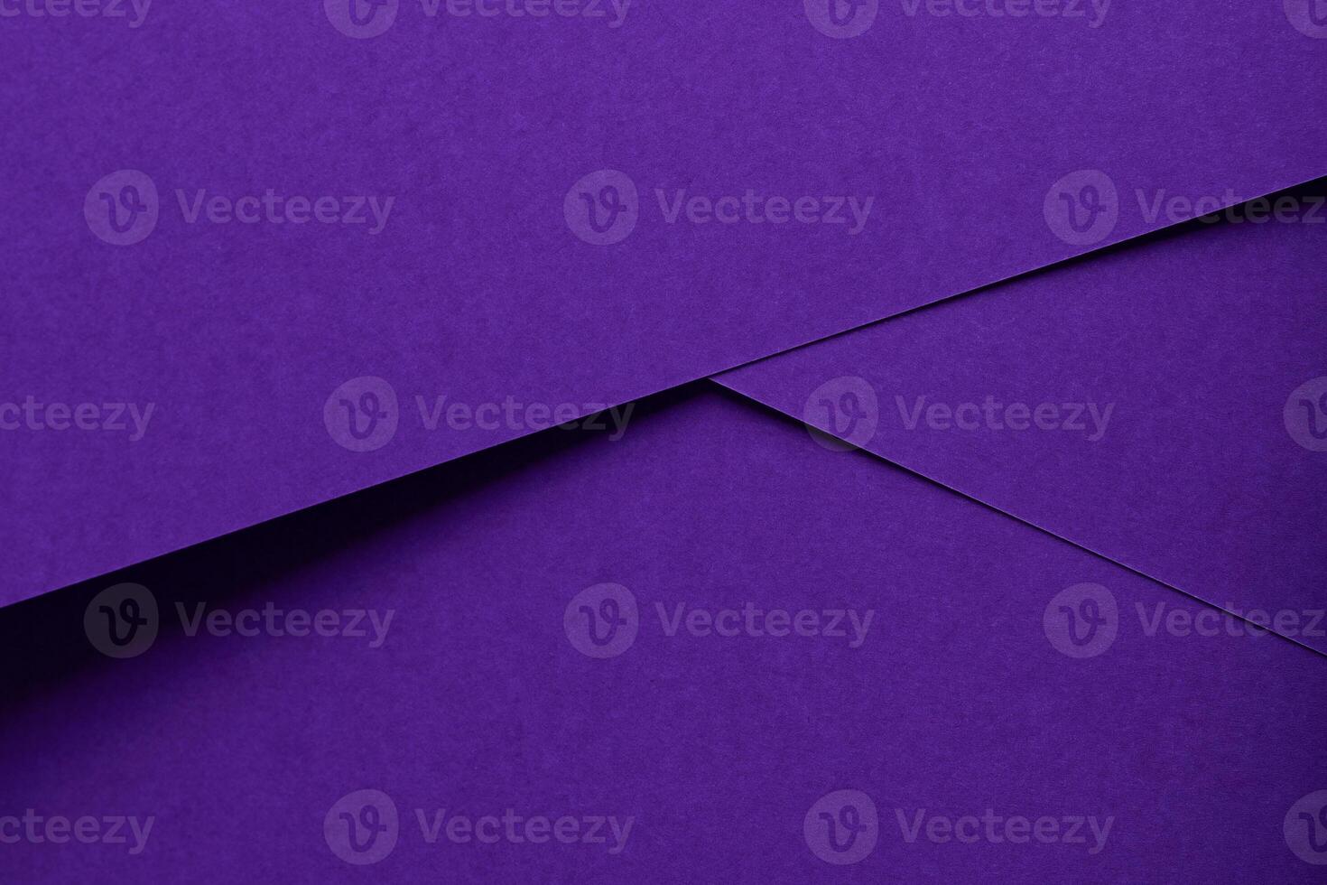 Premium designer paper in violet and purple tones with matte surface and elegant texture. photo
