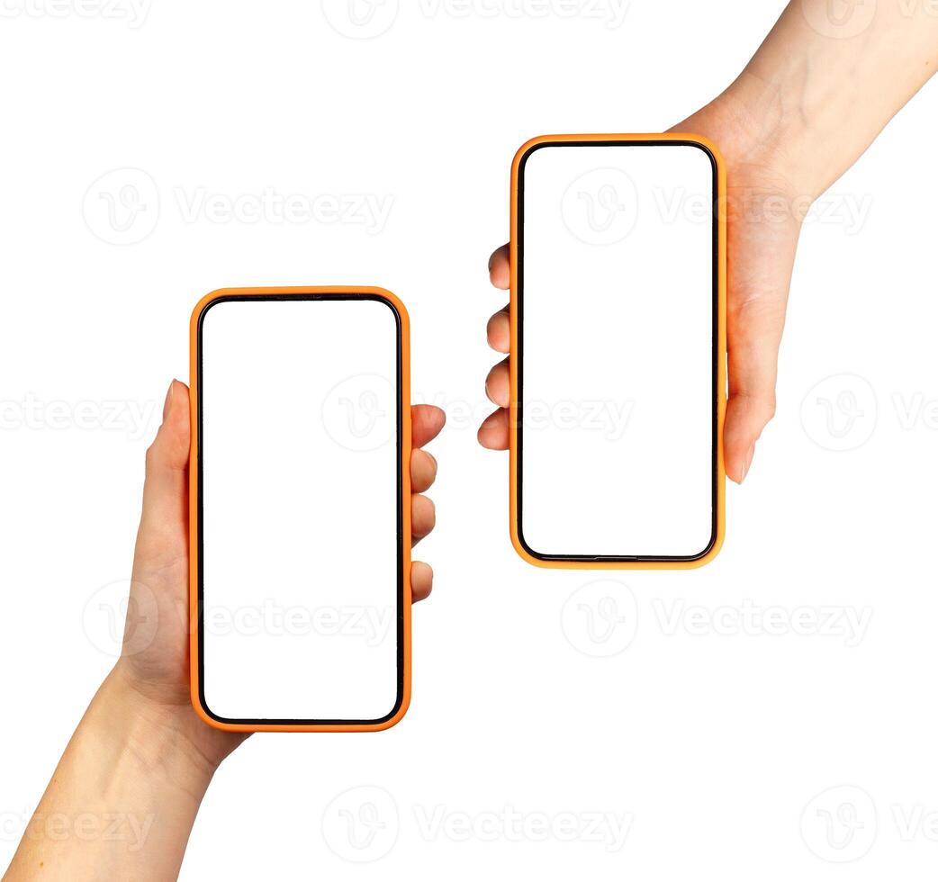 Hand holding two smartphones showing app screen. Mobile cellular devices with technology display. photo