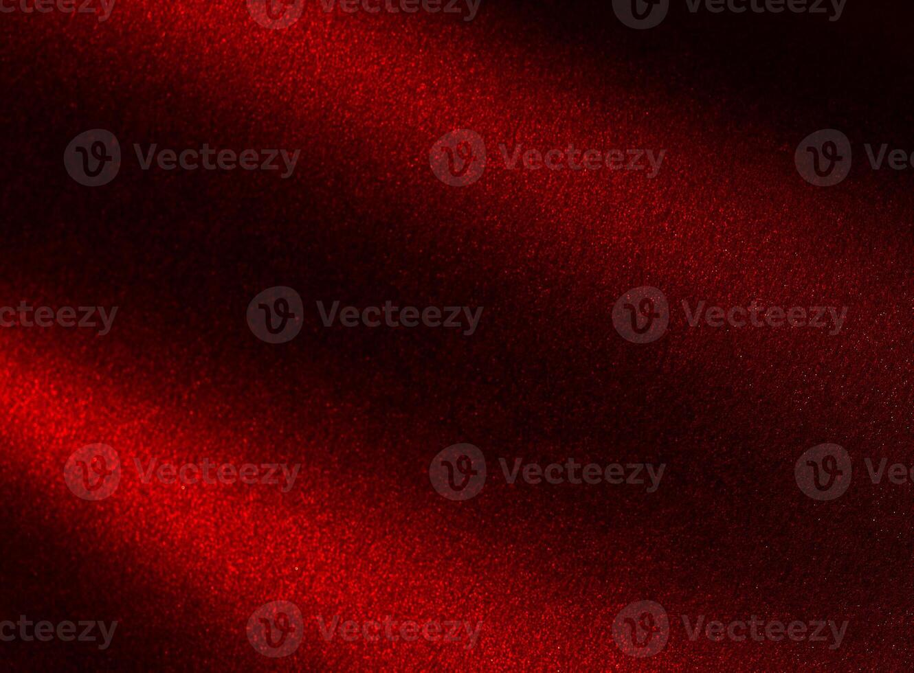 Elegant background with red gradient and sandy grain texture. Burgundy surface with shimmer glow, photo