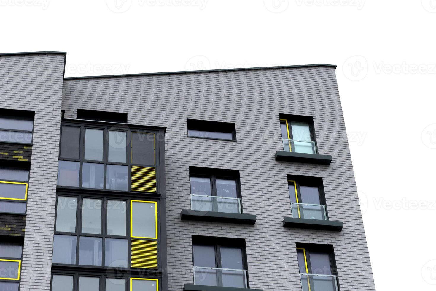 Architecture of modern apartment building with yellow and gray facade. Urban low rise housing photo