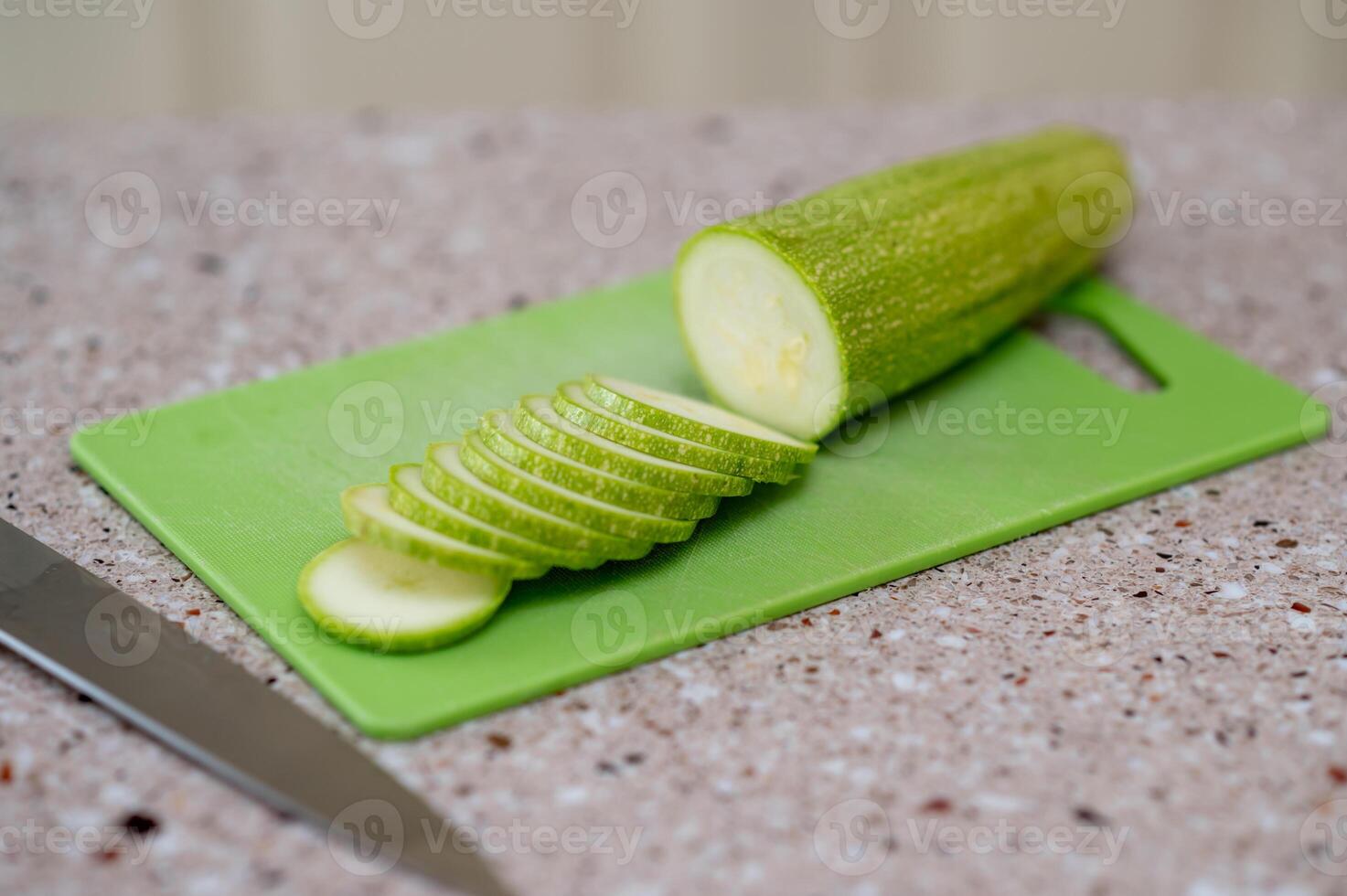 A green cutting board photo
