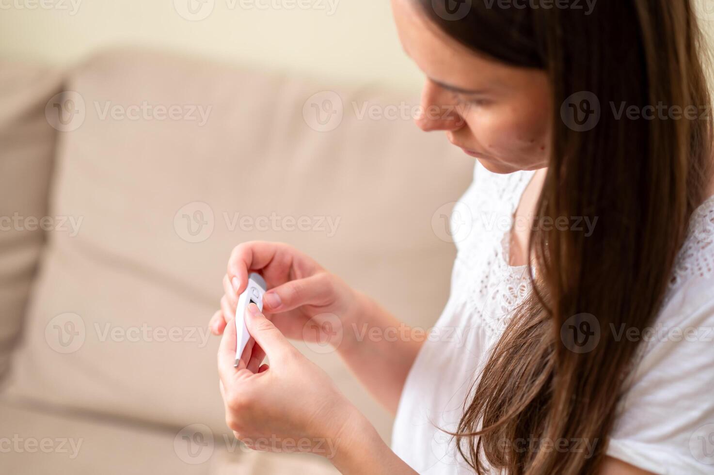 A woman is holding a piece of paper photo