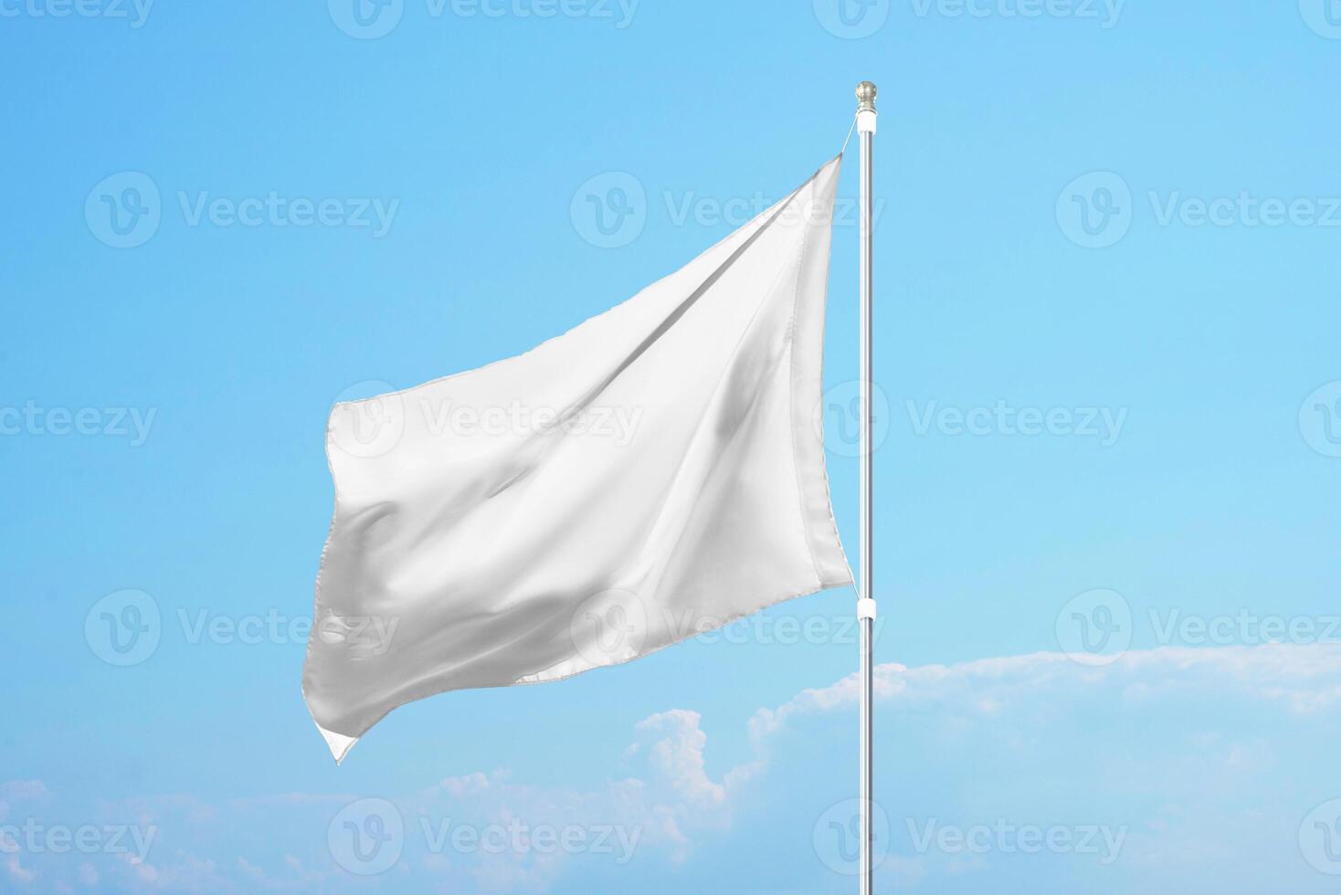 Empty white flag in the wind on clear blue sky, ideal for promotional design, customization or national identity mockups photo