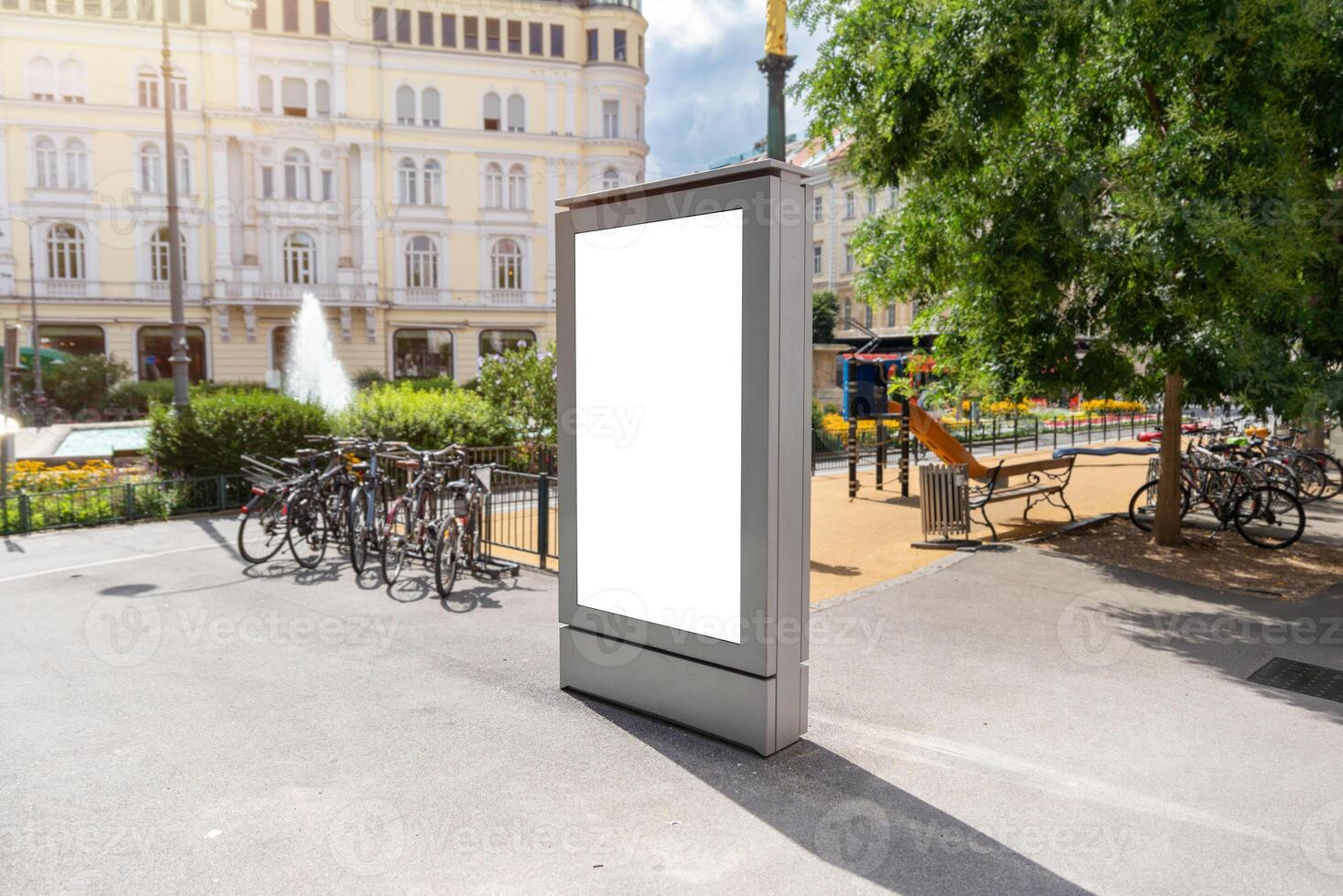 Empty city billboard mockup in square with bikes and fountain, ideal for advertising, promotions or commercial poster designs photo