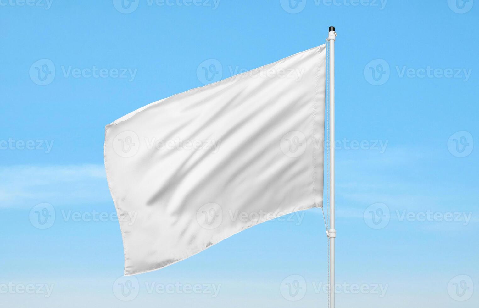 White flag waving against clear blue sky, symbol of peace, freedom, or surrender, ideal for editorial or visual content needs photo